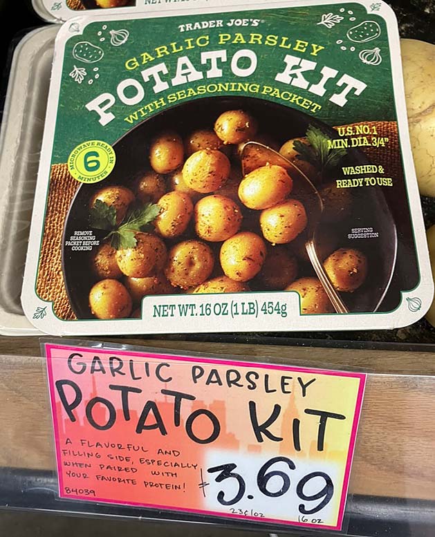 Trader Joe's Garlic Parsley Potato Kit packaging featuring small potatoes and a seasoning packet, priced at $3.69.